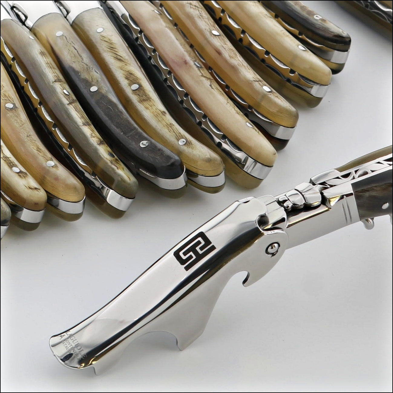 laguiole magnum with a logo engraved on the boot lever