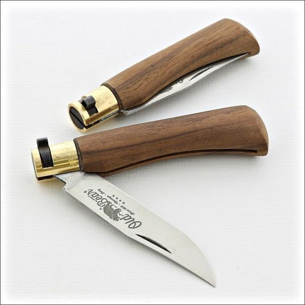Old Bear® Classic Walnut Pocket Knives. one is closed the other partially opened.  