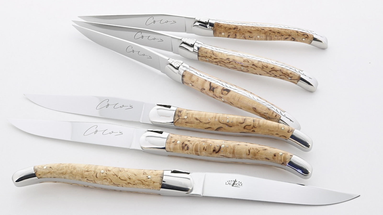 Coco's at Colette steak knives with blade micro-serrations- handles are made from karelian birch