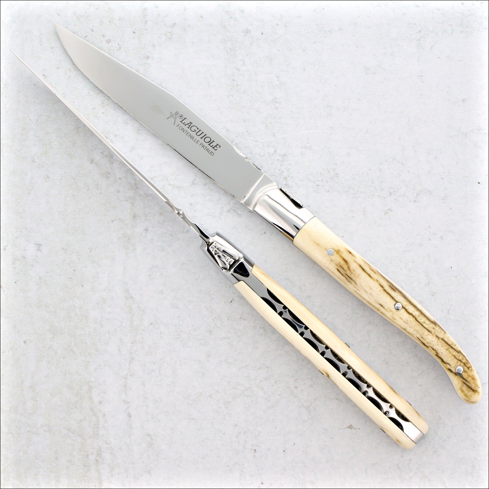 https://www.laguiole-imports.com/cdn/shop/files/Laguiole-Forged-Steak-Knives-Fossilized-Mammoth-Tusk-B-Fontenille-Pataud_1600x.jpg?v=1694946618