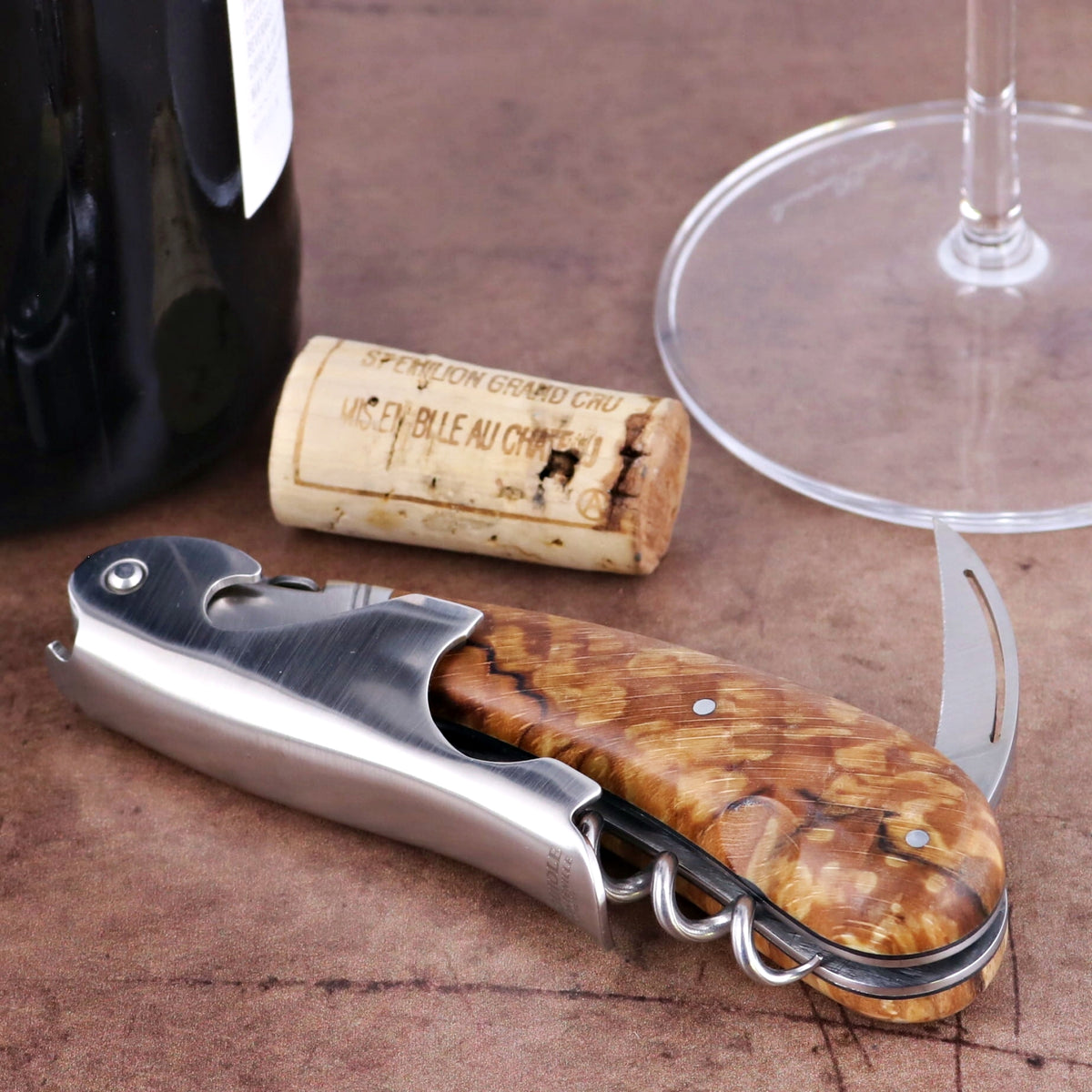 Laguiole Magnum Burled Beech End Grain Corkscrew, close-up of handle with stainless steel and wood.