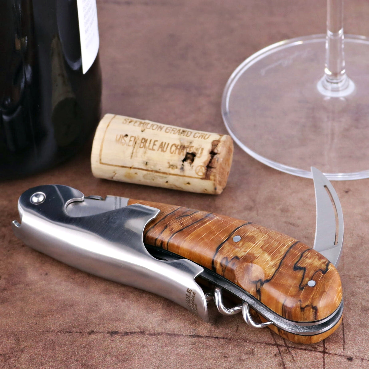 Laguiole Magnum Burled Beech End Grain Corkscrew, close-up of natural wood handle and polished steel.