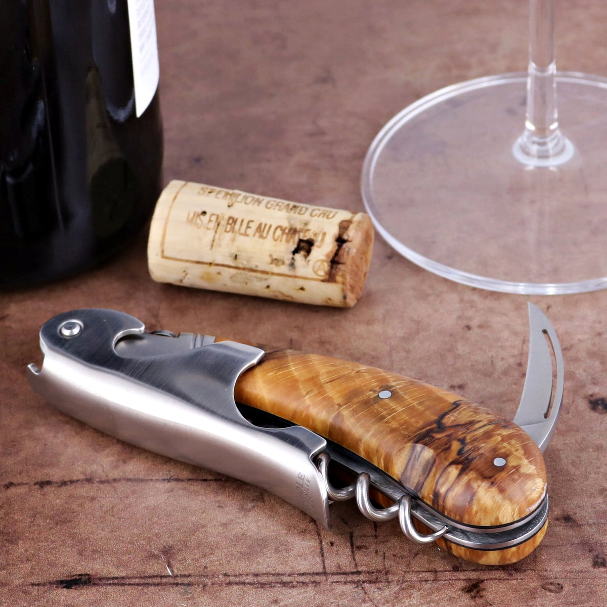 Laguiole Magnum Burled Beech End Grain Corkscrew, close-up of the elegant wood handle and polished steel.