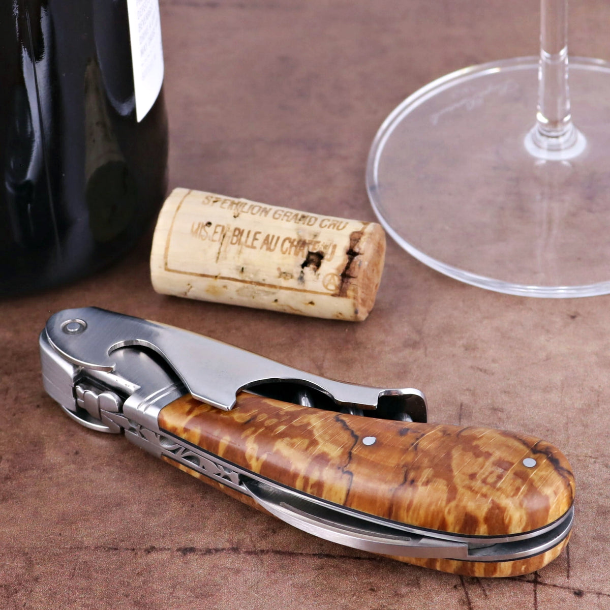 Laguiole Magnum Burled Beech End Grain Corkscrew, close-up of the elegant wood handle and polished steel.
