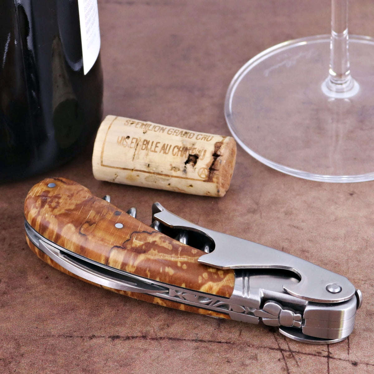 Laguiole Magnum Burled Beech End Grain Corkscrew, close-up of handle and stainless steel components.