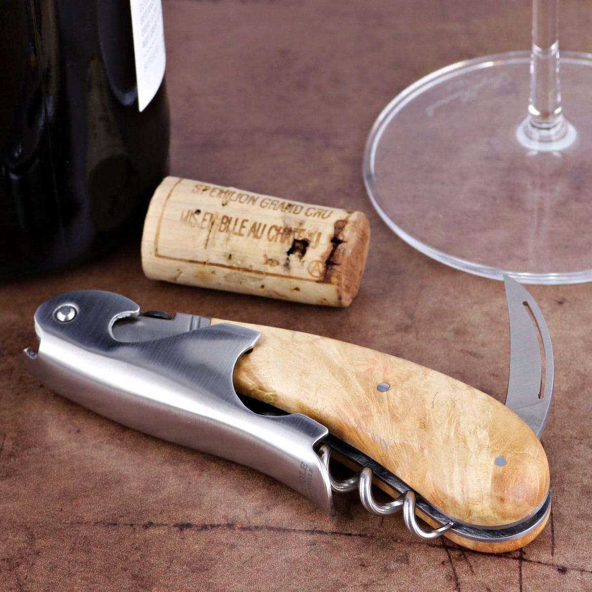 Laguiole Magnum Burled Maple Corkscrew, close-up of light wood handle, stainless steel, and foil cutter.