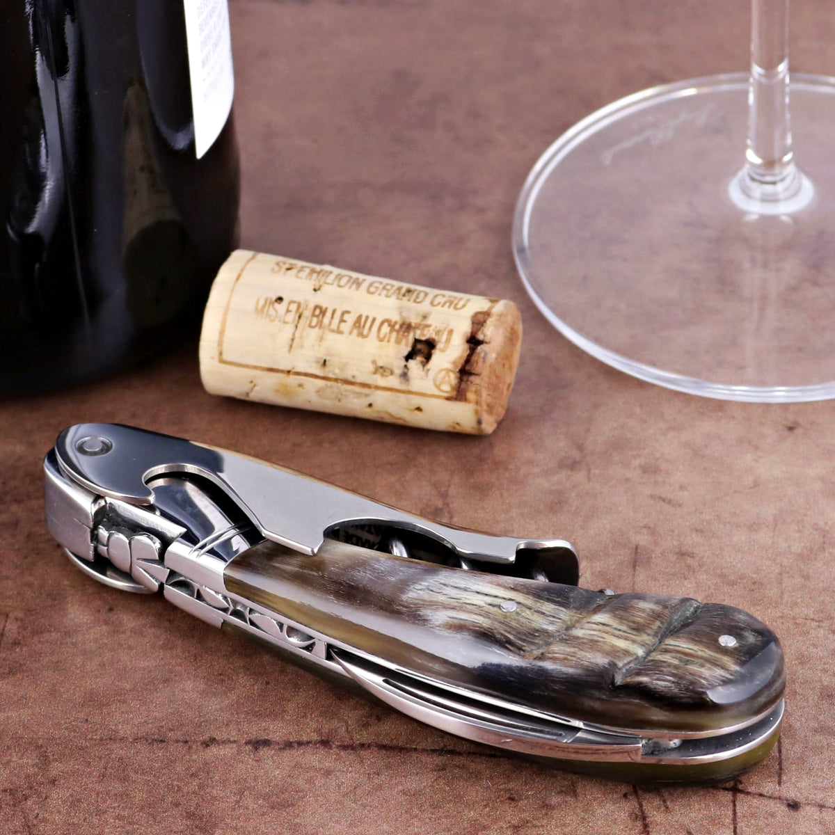 Laguiole Magnum Dark Ram Horn Corkscrew, close-up of dark horn handle and polished steel mechanism.