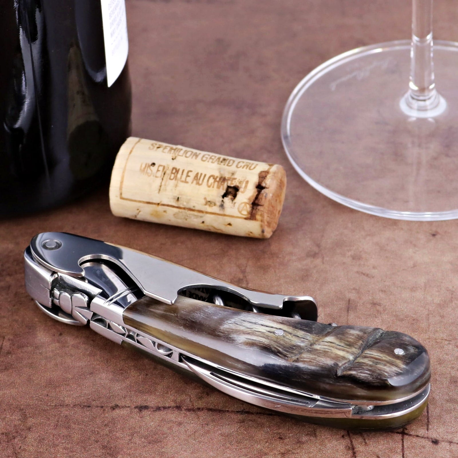 Laguiole Magnum Dark Ram Horn Corkscrew, close-up of polished steel and dark horn handle.