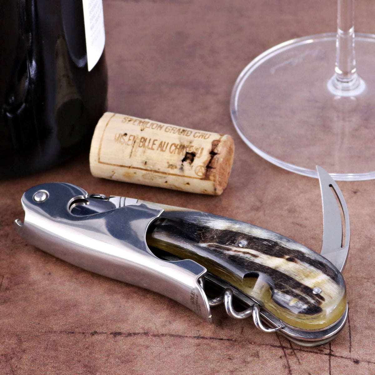 Laguiole Magnum Dark Ram Horn Corkscrew, close-up of polished steel and dark horn handle.