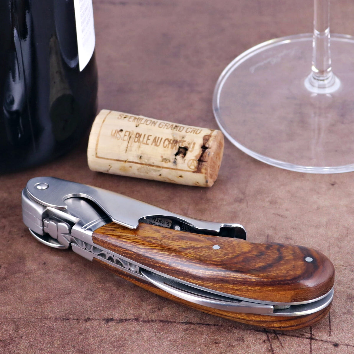 Laguiole Magnum Desert Ironwood Corkscrew, close-up of the elegant wood handle and polished steel.