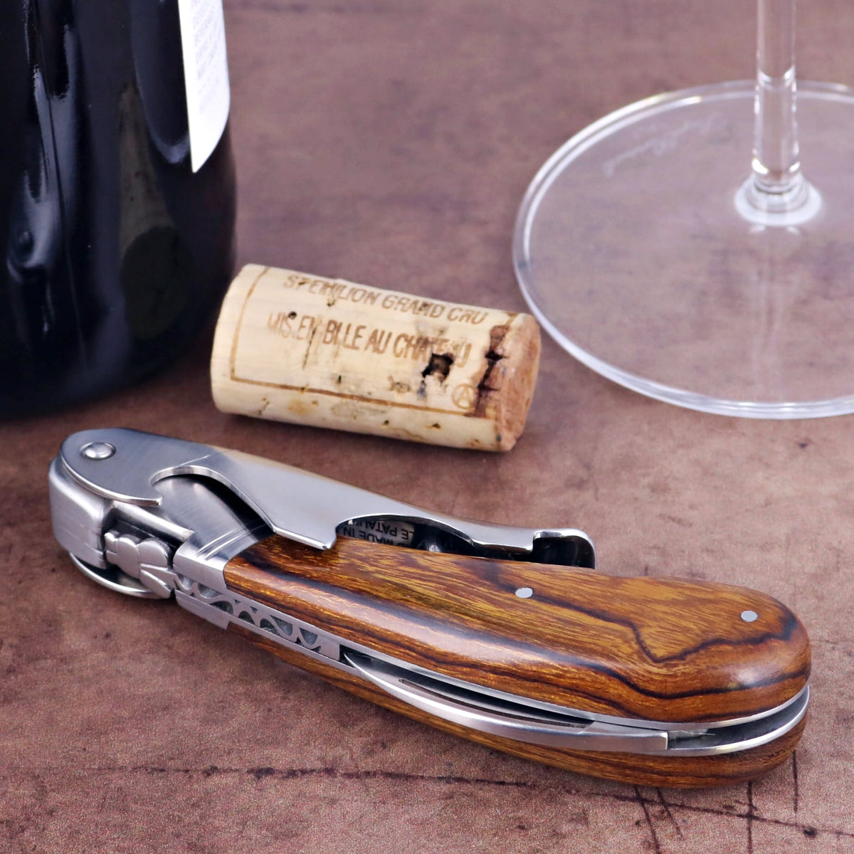 Laguiole Magnum Desert Ironwood Corkscrew, close-up of the elegant wood handle and polished metal.