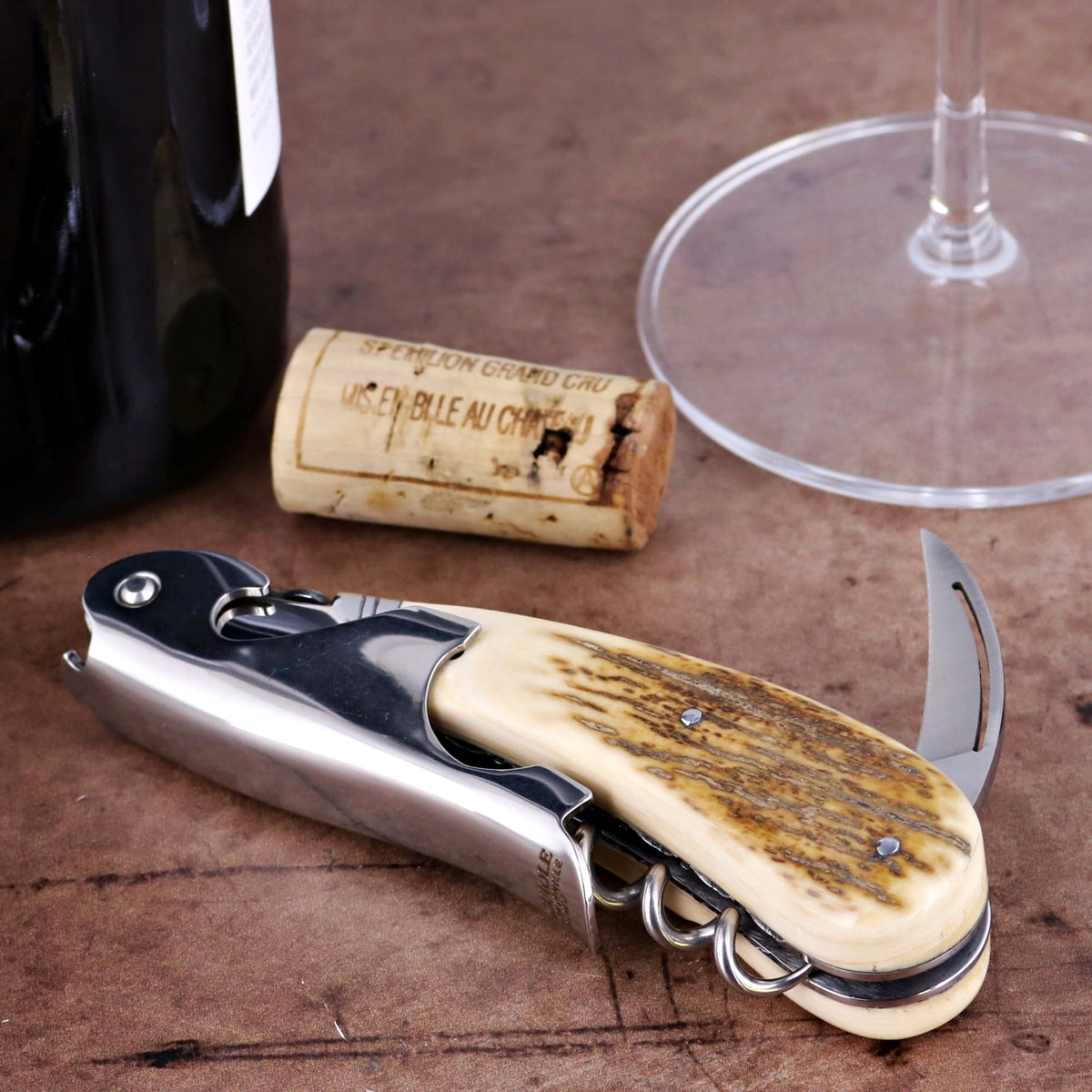 Laguiole Magnum Guilloche Fossilized Mammoth Ivory Corkscrew, close-up of handle.