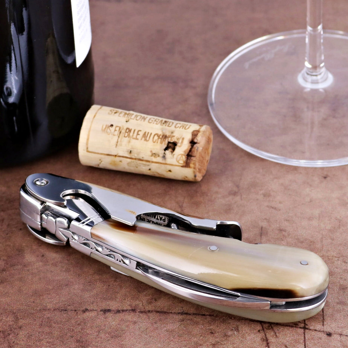 Laguiole Magnum Horn Tip Corkscrew, close-up side view of horn handle and polished steel.