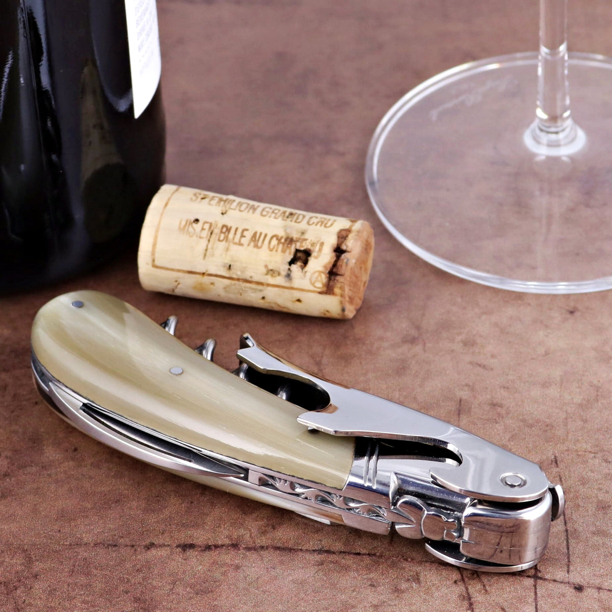 Laguiole Magnum Horn Tip Corkscrew, close-up of light horn handle and polished steel.