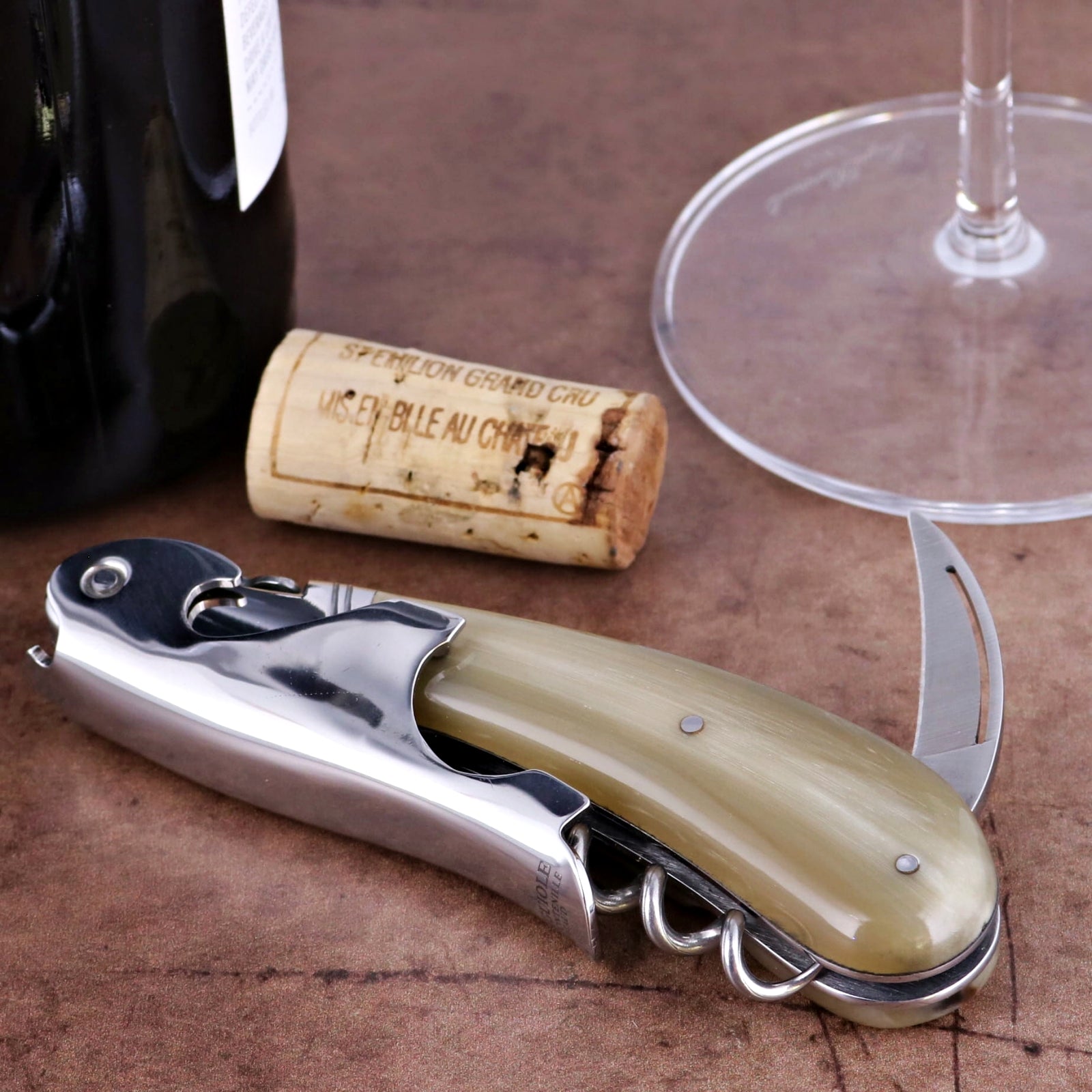 Laguiole Magnum Horn Tip Corkscrew - C, side view of the polished horn handle and stainless steel body. Handcrafted details, 100% Made in France.