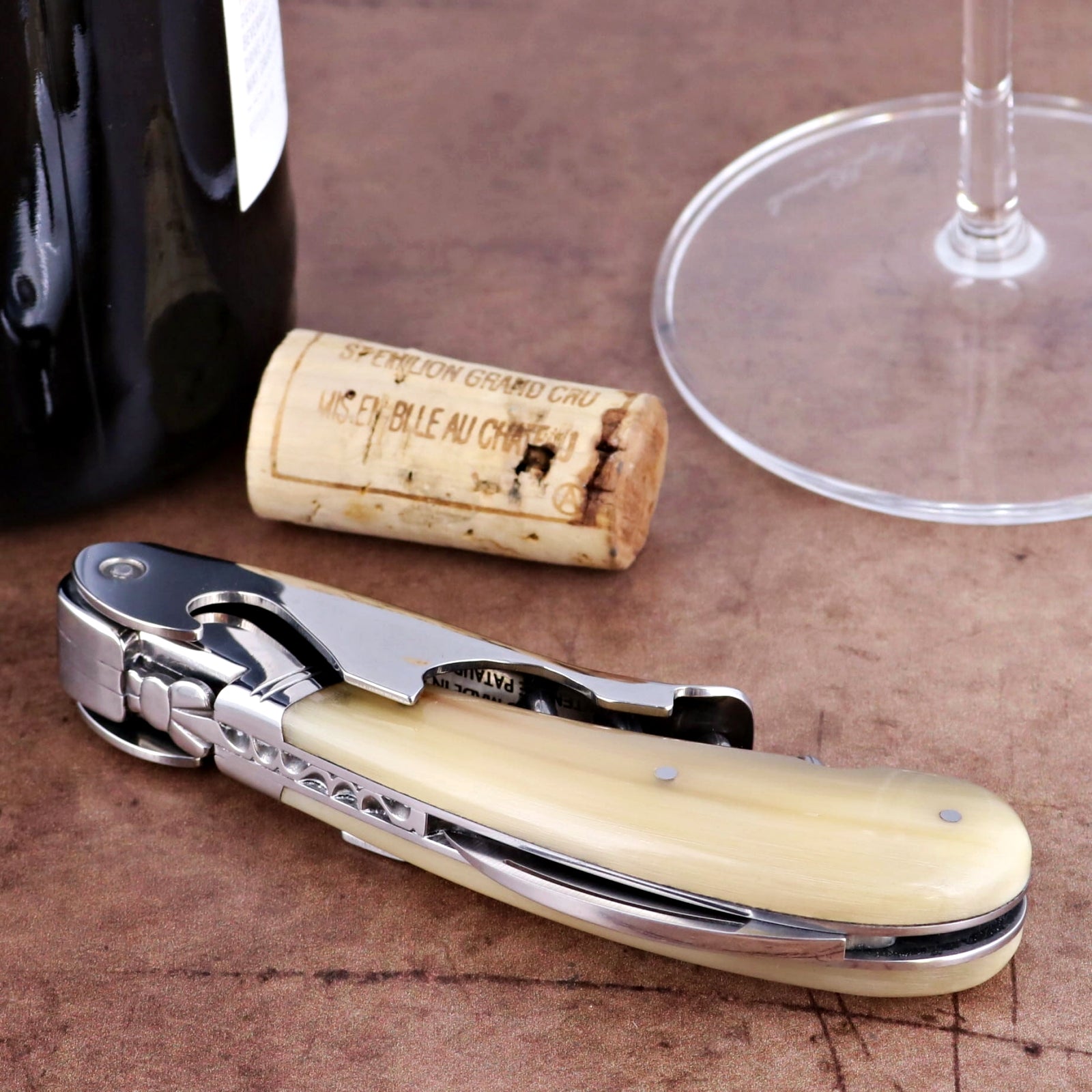 Laguiole Magnum Horn Tip Corkscrew, close-up of cream handle, foil cutter, and worm.