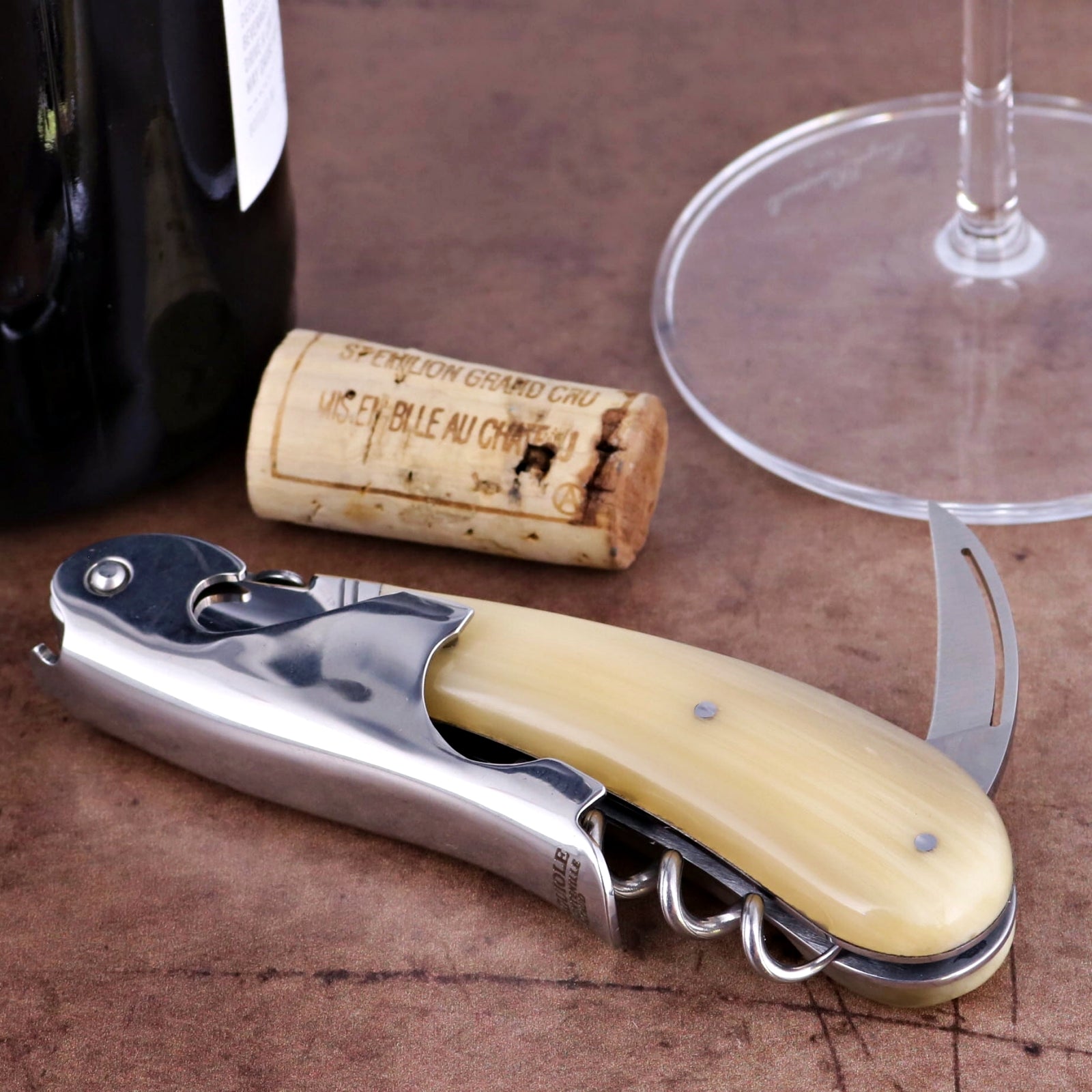 Laguiole Magnum Horn Tip Corkscrew, close-up of cream handle, foil cutter, and worm.