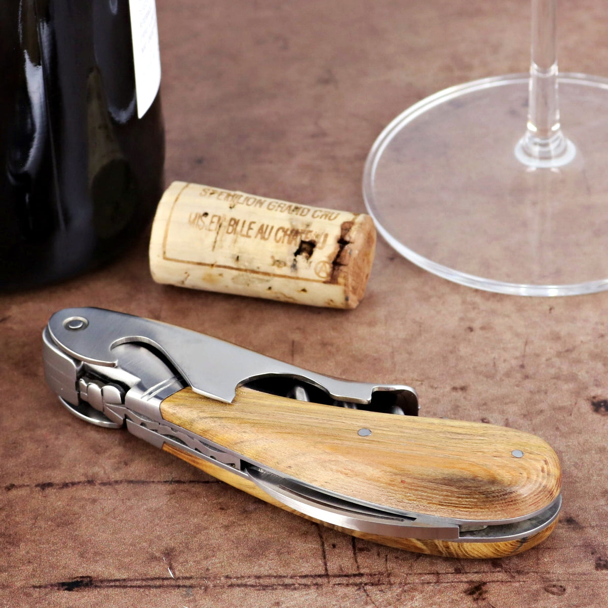 Laguiole Magnum Pistachio Corkscrew, close-up of wooden handle and stainless steel tools.