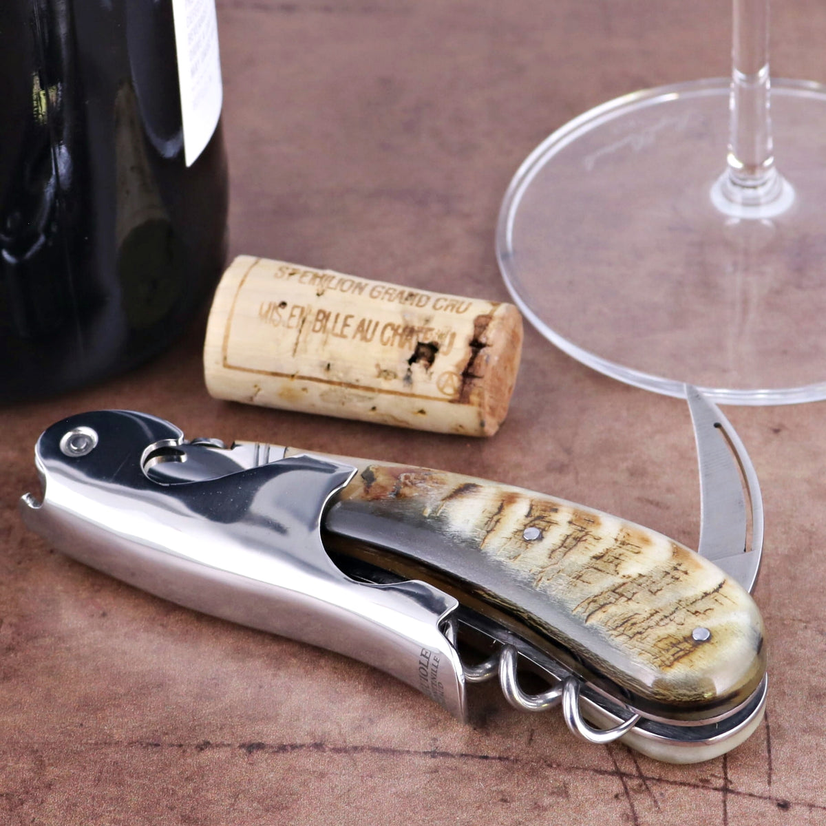 Laguiole Magnum Ram Horn Corkscrew - H, close-up of the elegant ram horn handle and polished steel.