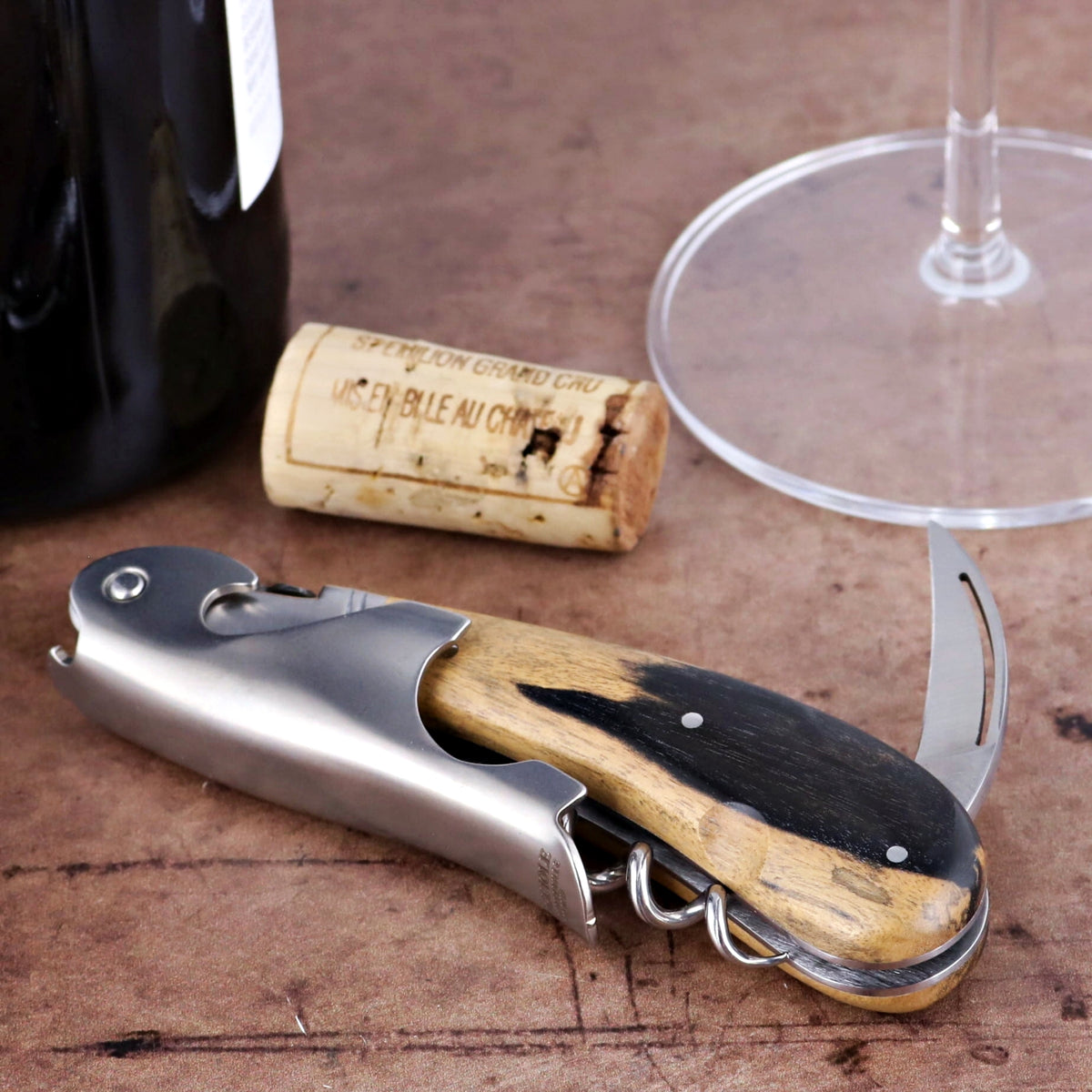 Laguiole Magnum Royal Ebony Corkscrew, close-up of ebony and wood handle with stainless steel.