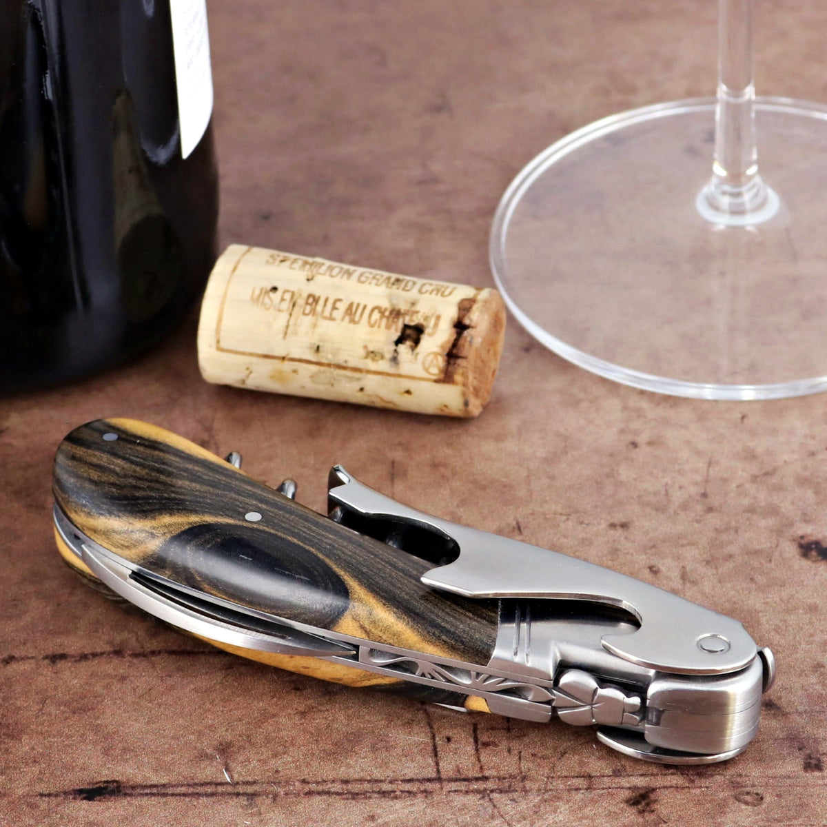 Laguiole Magnum Royal Ebony Corkscrew, close-up of ebony wood handle and stainless steel body.