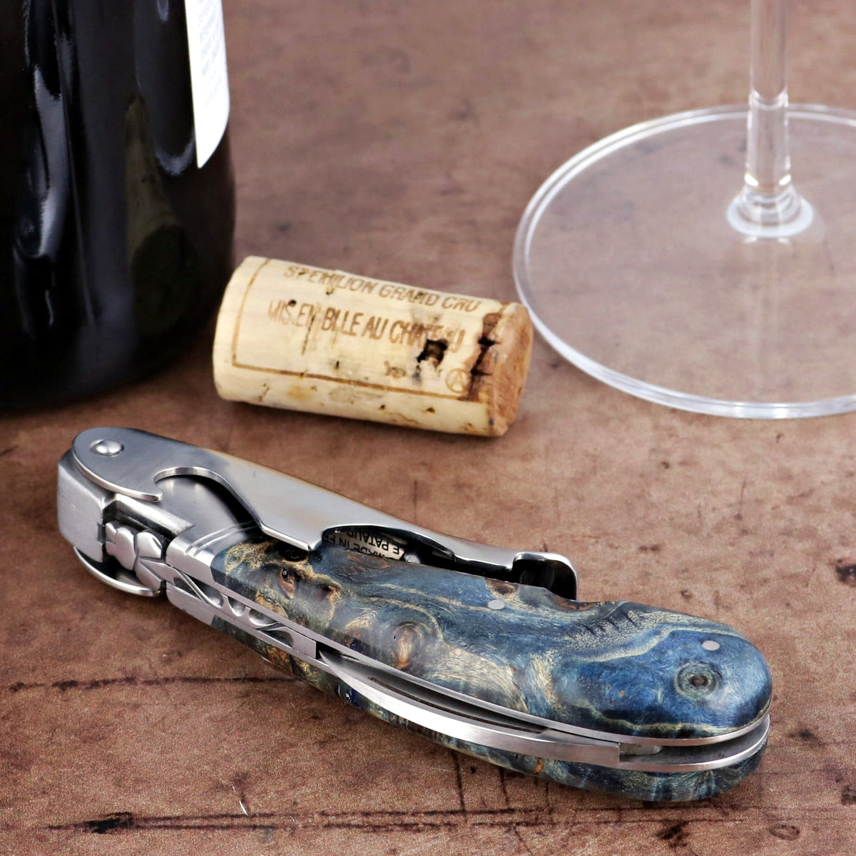Laguiole Magnum Corkscrew Blue, side view of stained poplar burl handle.