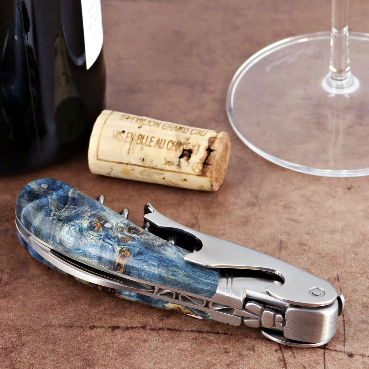 Laguiole Magnum Corkscrew Blue, close-up of blue stained poplar burl handle and stainless steel tools.