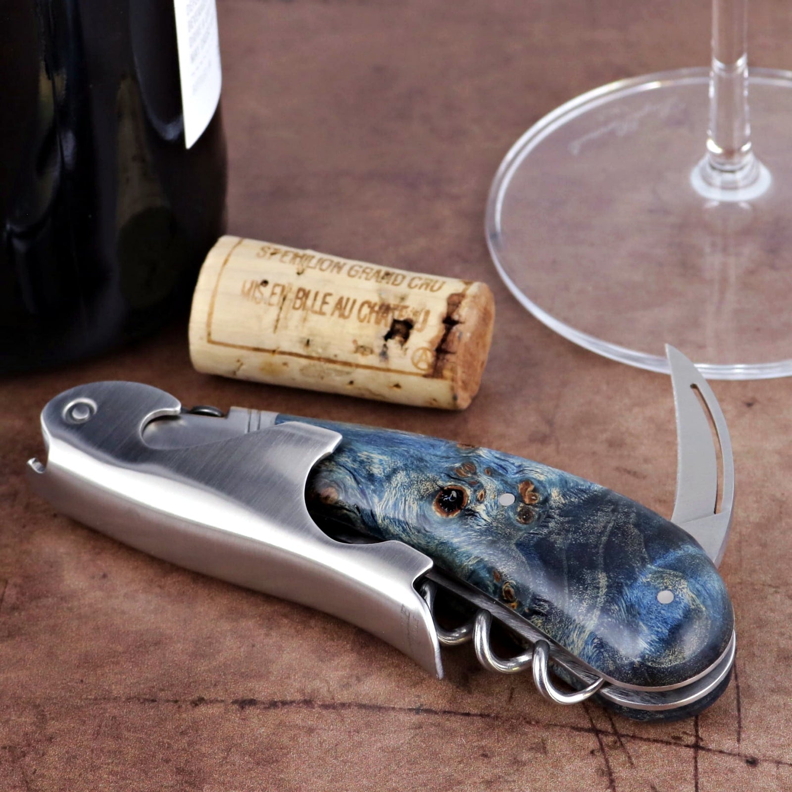 Laguiole Magnum Stained Poplar Burl Corkscrew Blue, close-up of blue burl handle and stainless steel body.