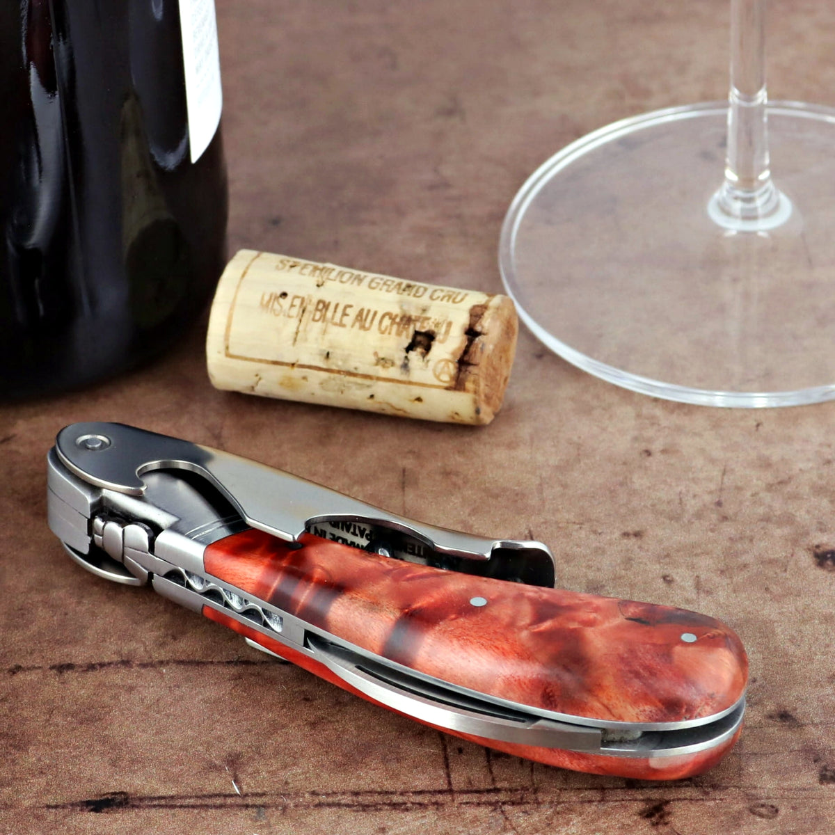 Laguiole Magnum Stained Poplar Burl Corkscrew Red - E, close-up of the red burl handle.