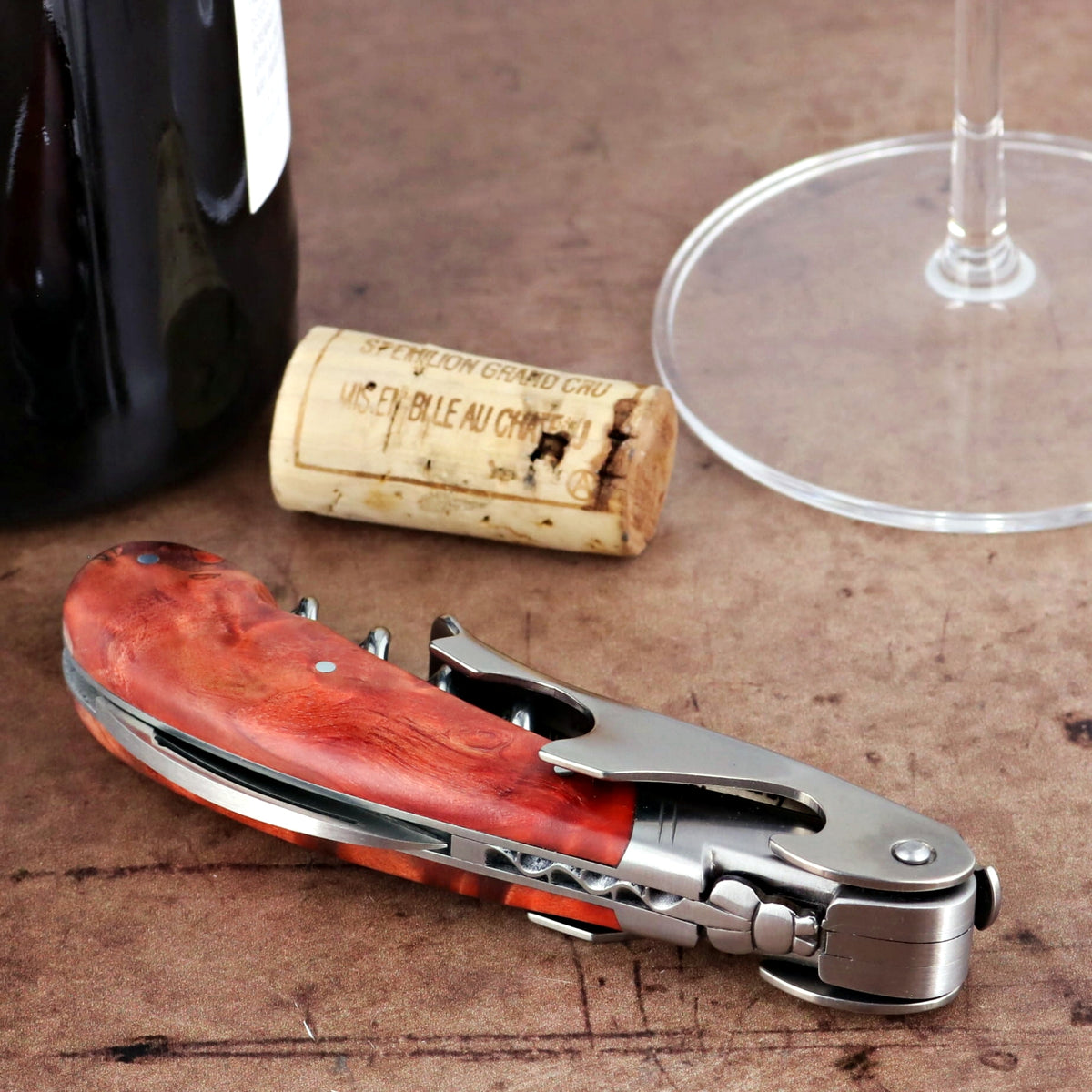 Laguiole Magnum Stained Poplar Burl Corkscrew Red, close-up of the elegant red wood handle.
