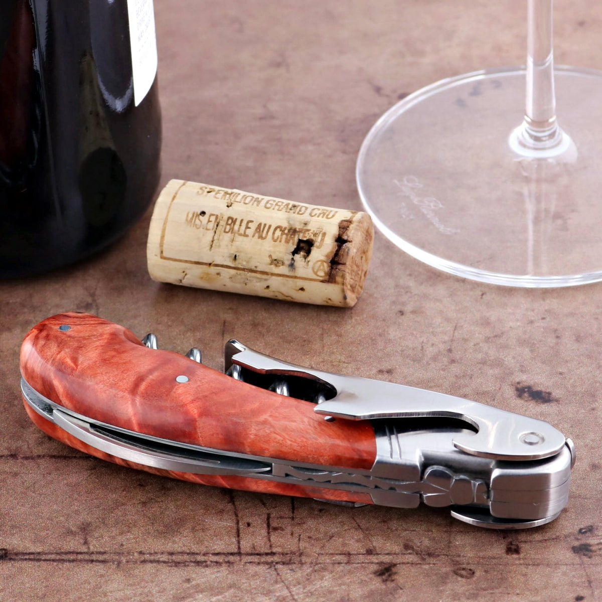 Laguiole Magnum Corkscrew Red, close-up of stained poplar burl handle and stainless steel tools.