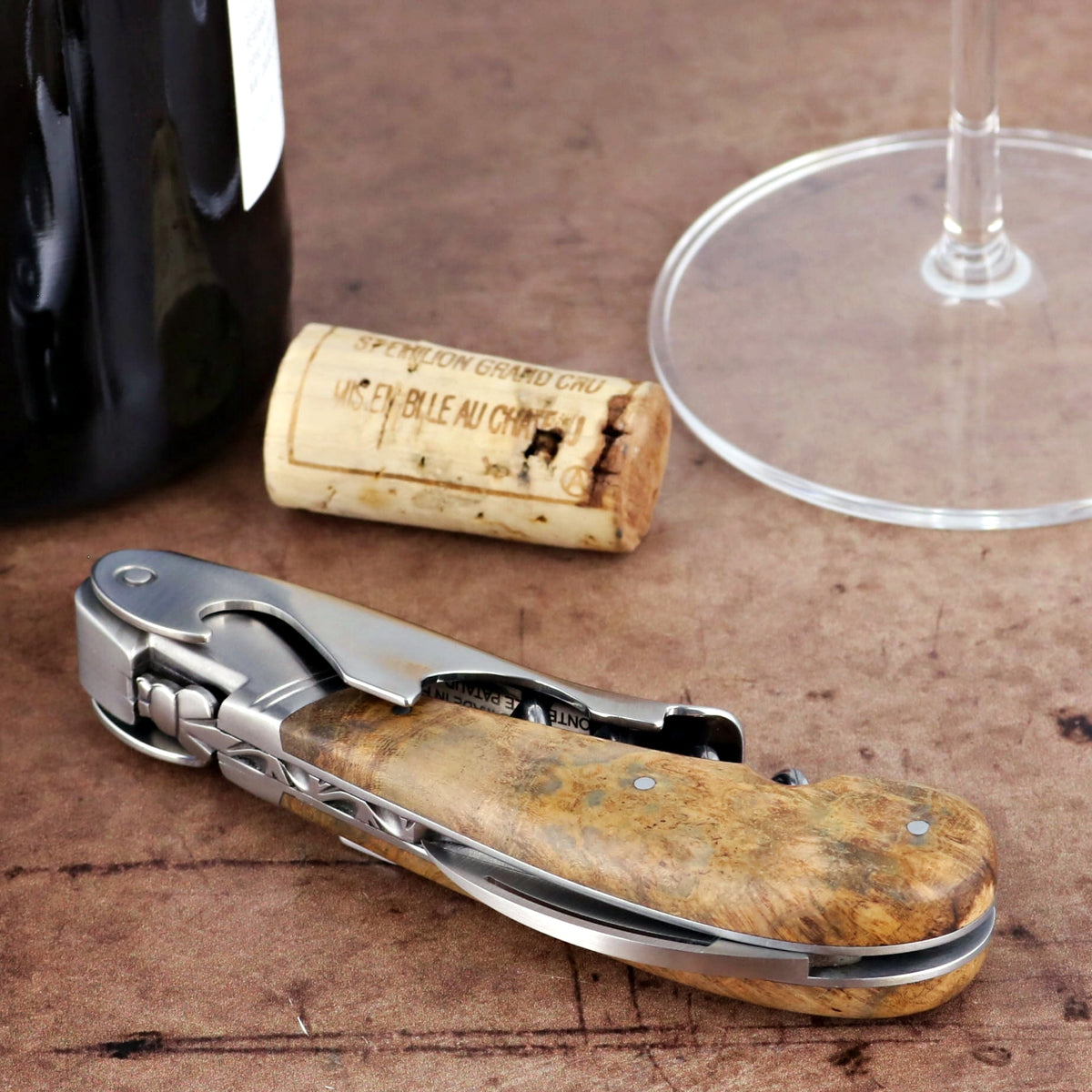Laguiole Magnum Teak Corkscrew, close-up of teak wood handle and stainless steel mechanism.