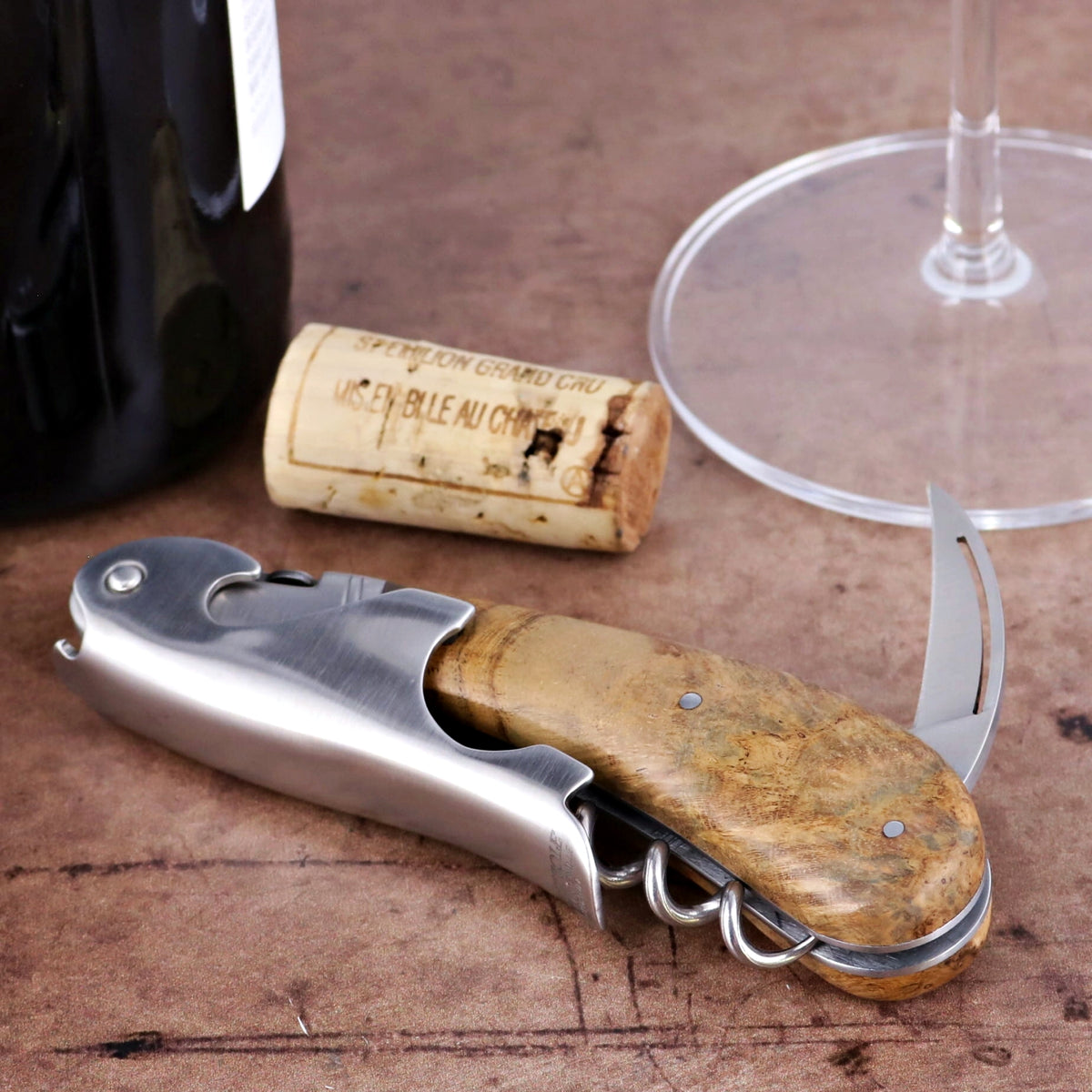 Laguiole Magnum Teak Corkscrew, close-up of the natural teak wood handle and brushed stainless steel.