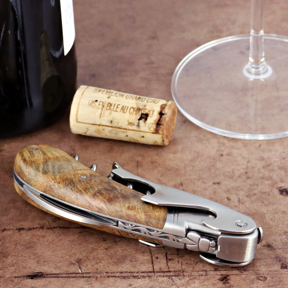 Laguiole Magnum Teak Corkscrew, close-up of teakwood handle and stainless steel mechanism.