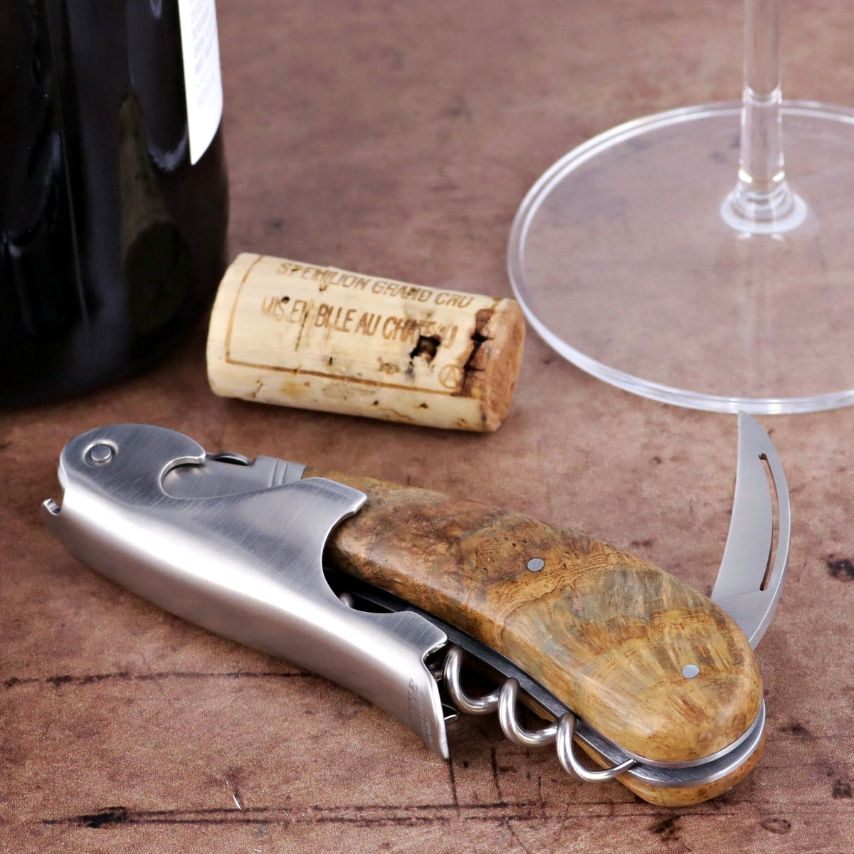 Laguiole Magnum Teak Corkscrew, close-up of the stainless steel and natural teak wood handle.