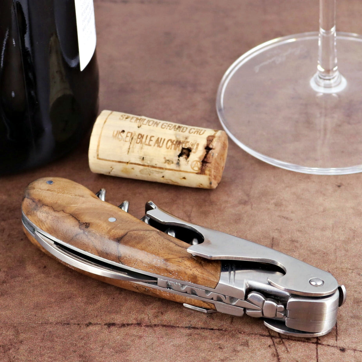 Laguiole Magnum Walnut Corkscrew - B, close-up of the elegant walnut handle and stainless steel tools.