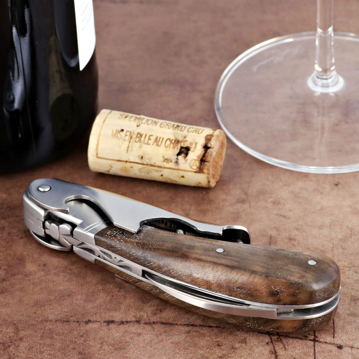 Laguiole Magnum Walnut Corkscrew, close-up of the elegant walnut handle and stainless steel details.