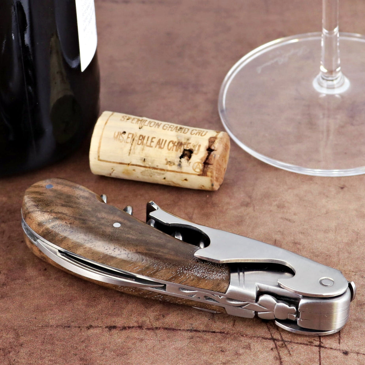 Laguiole Magnum Walnut Corkscrew, close-up of the elegant wood handle and stainless steel tools.