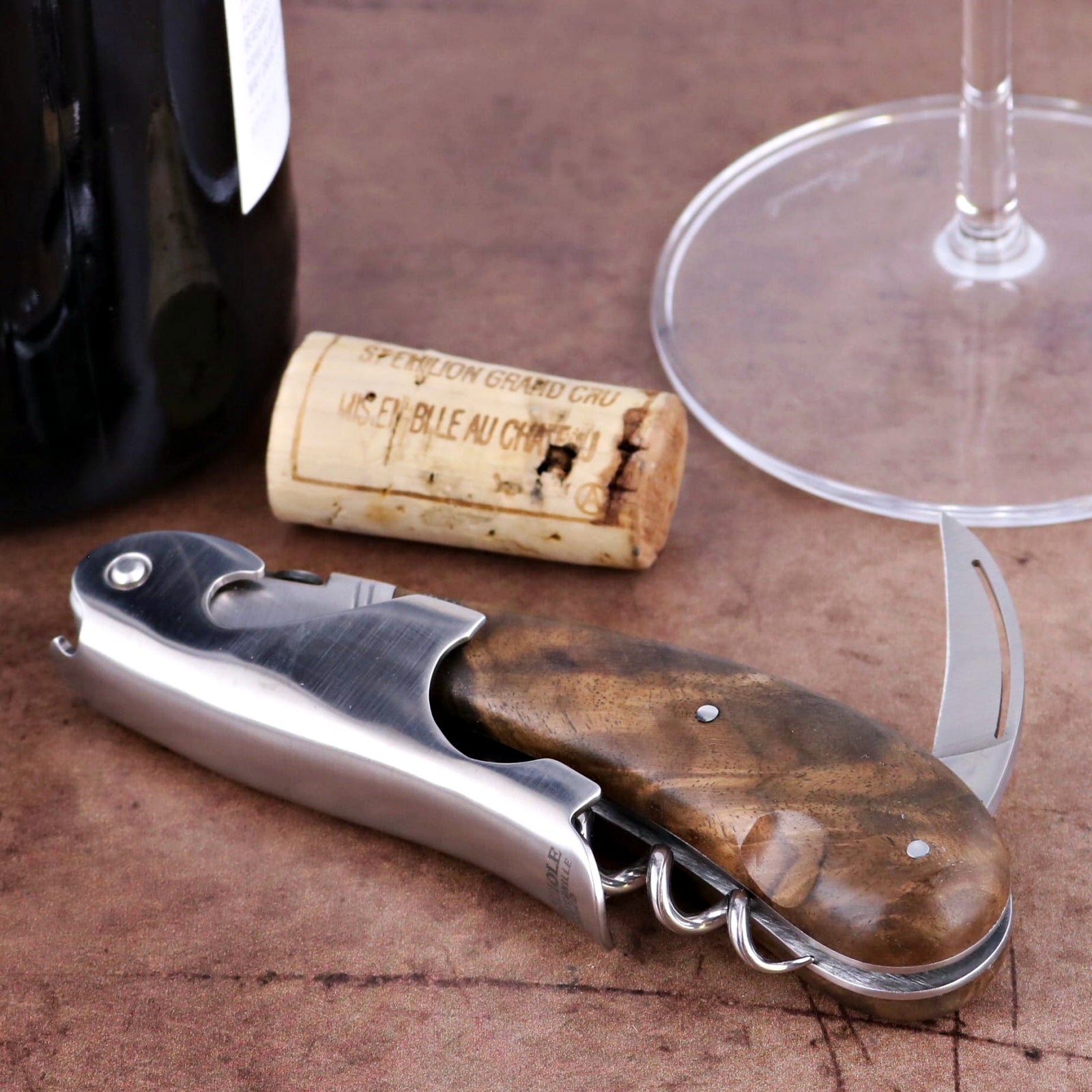 Laguiole Magnum Walnut Corkscrew, close-up of polished stainless steel and dark walnut handle.