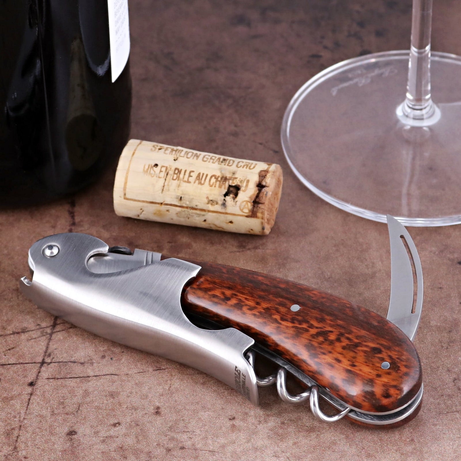 Laguiole Magnum Amourette Corkscrew close-up featuring a polished steel body and rich wood handle.