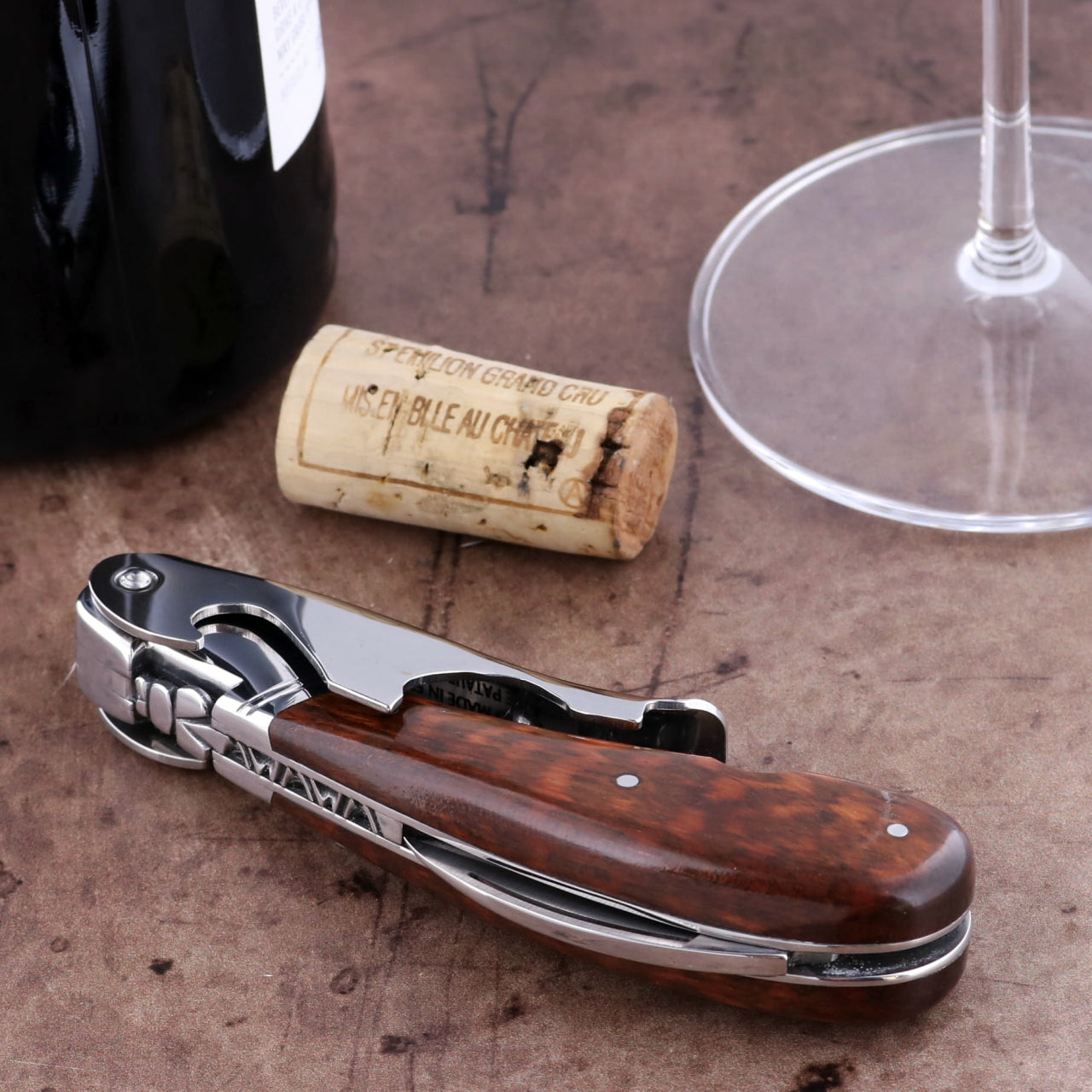 Laguiole Magnum Amourette Corkscrew, close-up of the polished stainless steel and dark wood handle.