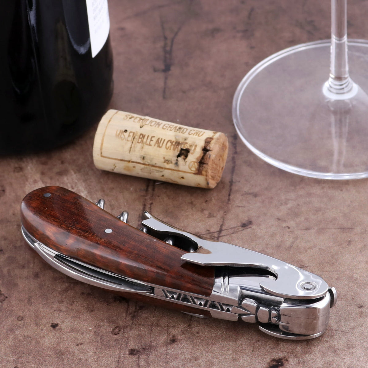 Laguiole Magnum Amourette Corkscrew, close-up of dark wood handle and polished silver tools.