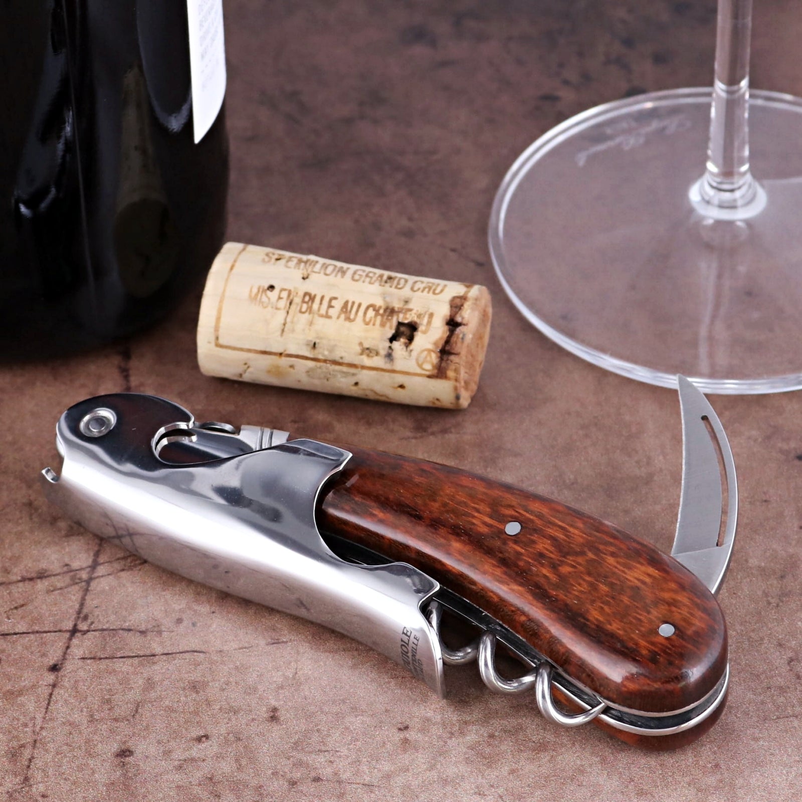 Laguiole Magnum Amourette Corkscrew close-up featuring a polished steel body and rich wood handle.