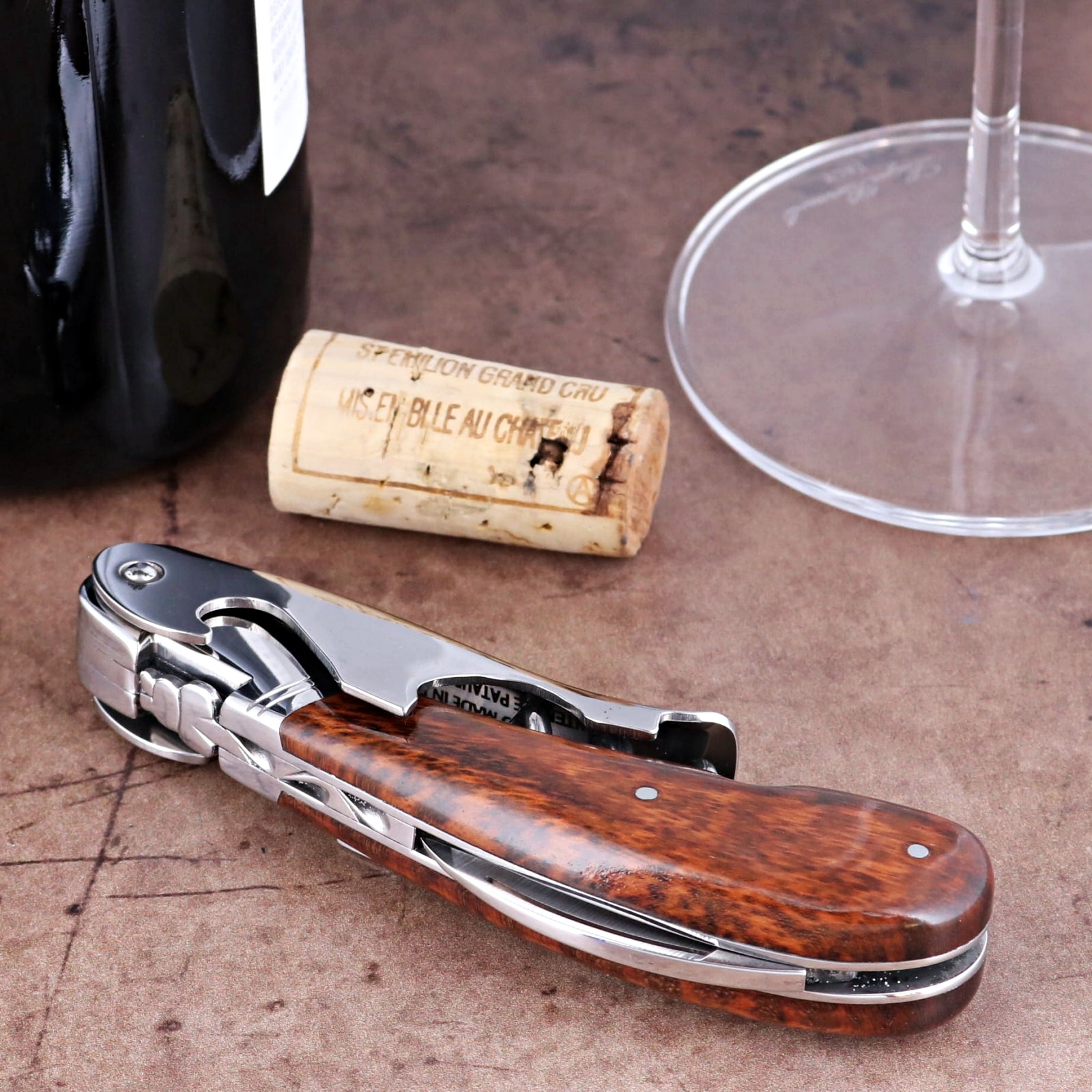 Laguiole Magnum Amourette Corkscrew close-up featuring a polished steel body and rich wood handle.