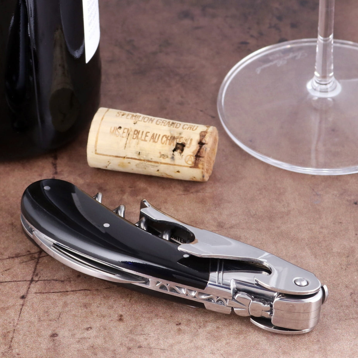 Laguiole Magnum Black Horn Tip Corkscrew, close-up of polished black horn handle and steel mechanism.