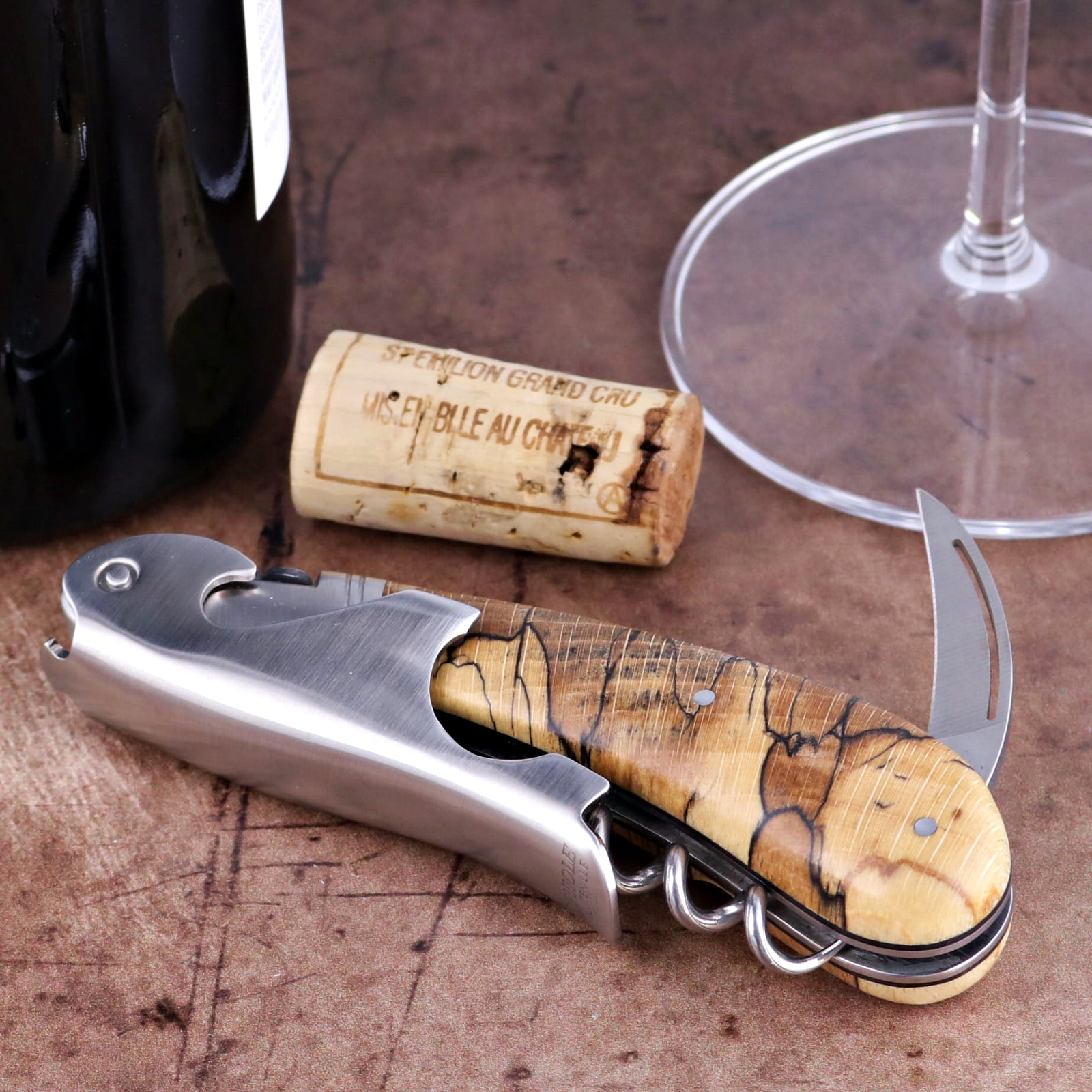 Laguiole Magnum Burled Beech Corkscrew close-up showing the wood grain handle and steel foil cutter.