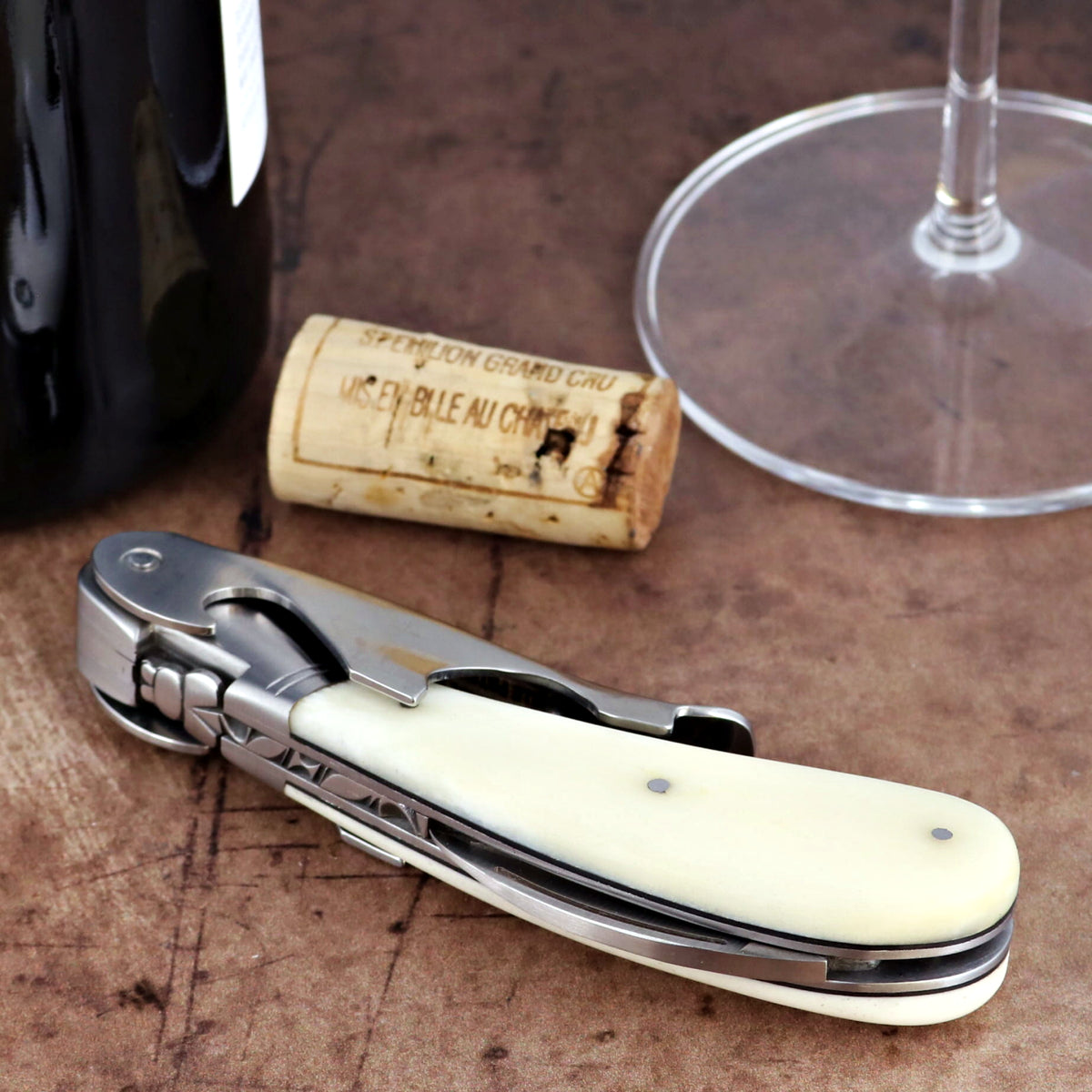 Laguiole Magnum Cattle Bone Handle Corkscrew, close-up side view of cream bone handle and steel tool.