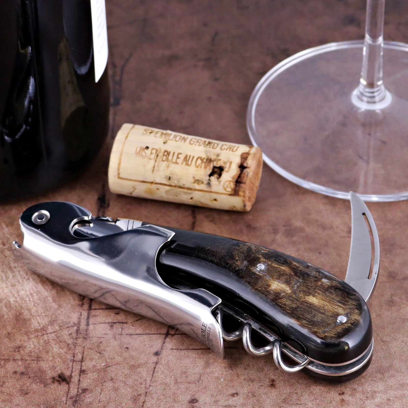 Laguiole Magnum Dark Ram Horn Corkscrew, close-up side view showing polished steel and horn handle.