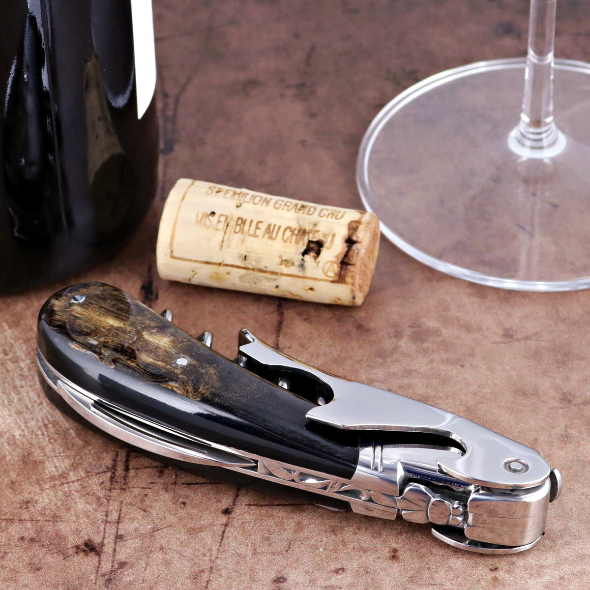 Laguiole Magnum Dark Ram Horn Corkscrew, close-up of polished dark horn handle and steel mechanism.
