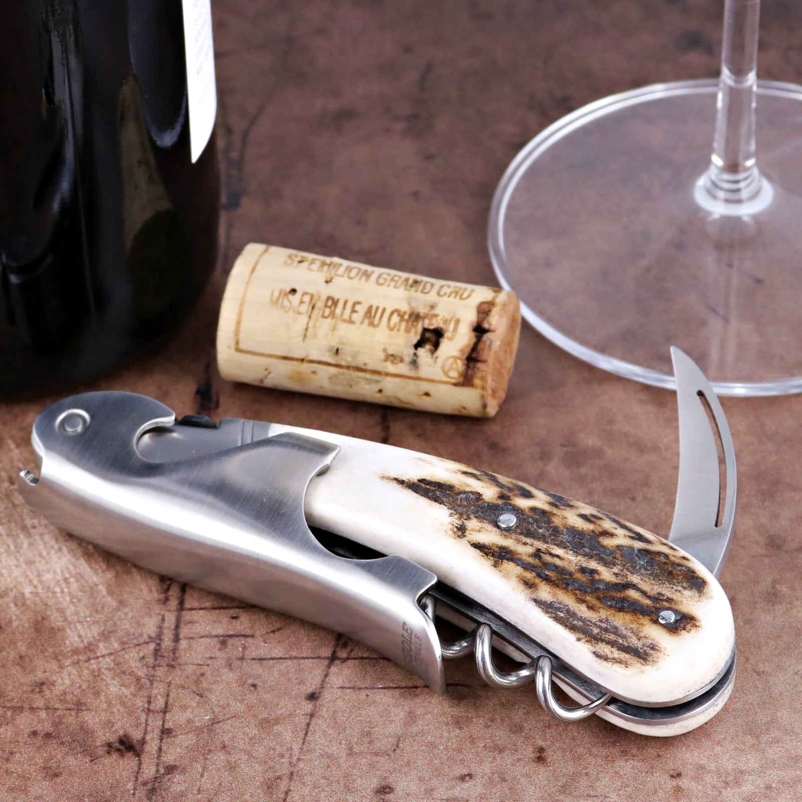 Laguiole Magnum Deer Stag Corkscrew close-up showing textured antler handle and stainless steel tool.